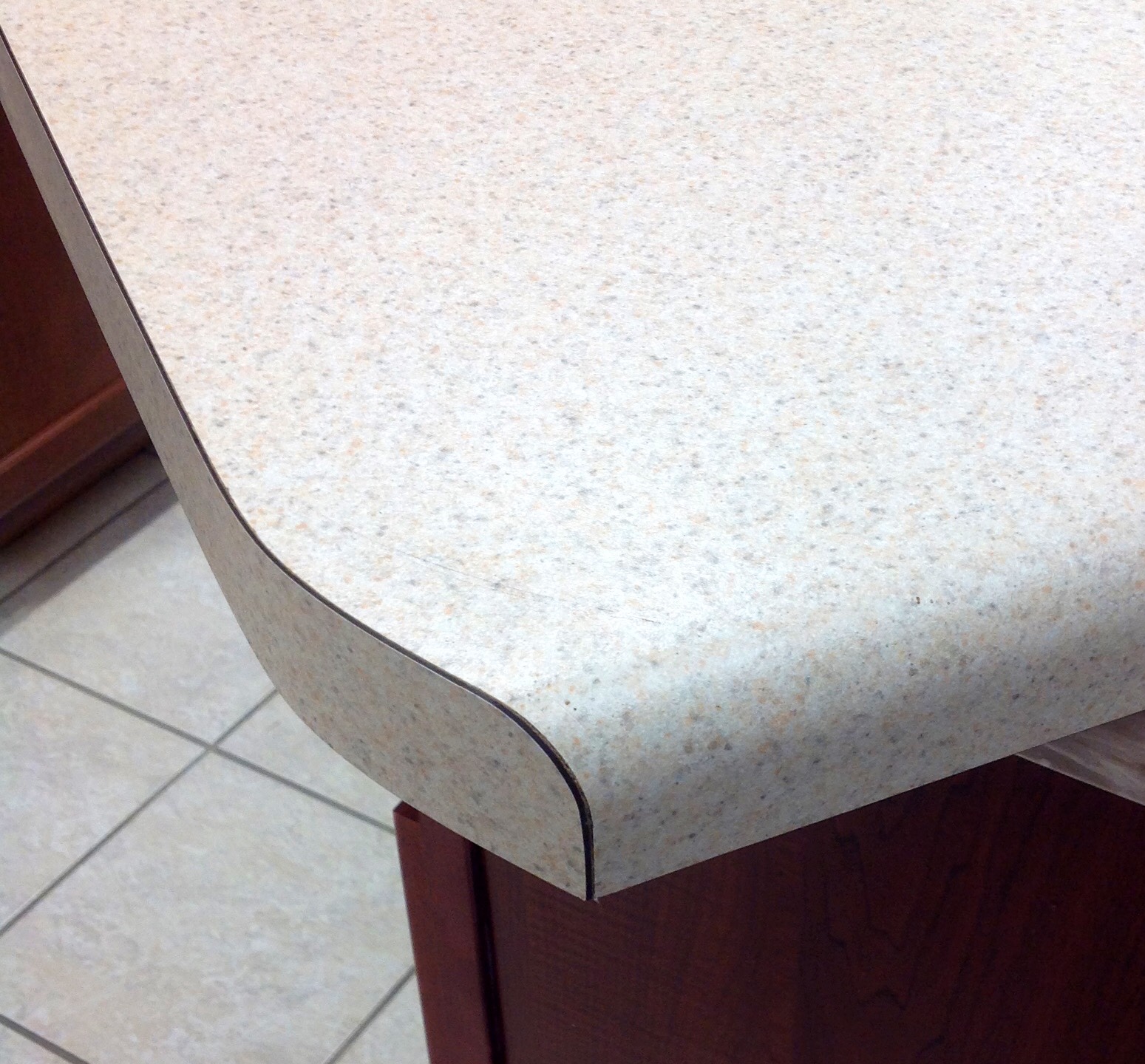 Post-forming laminate countertop in workshop